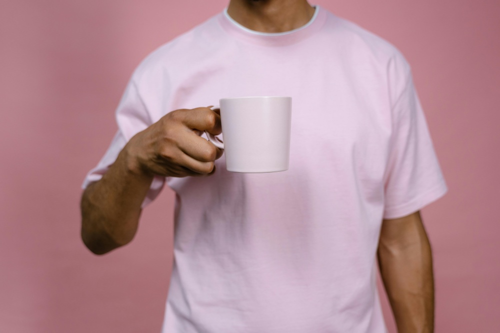 a man wear a pink tee