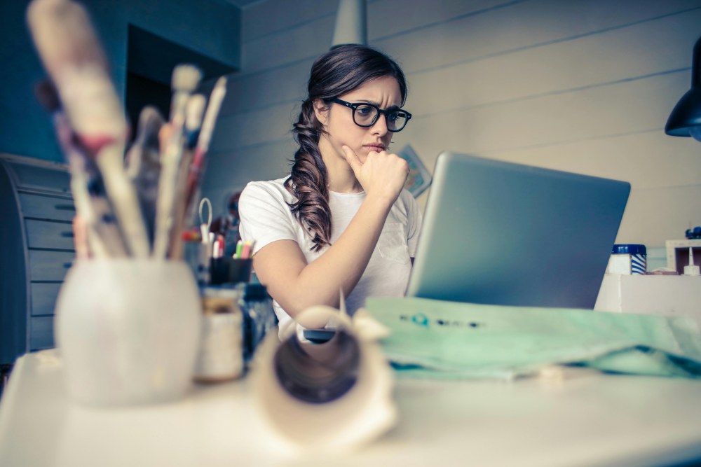 a lady working wtih a PC