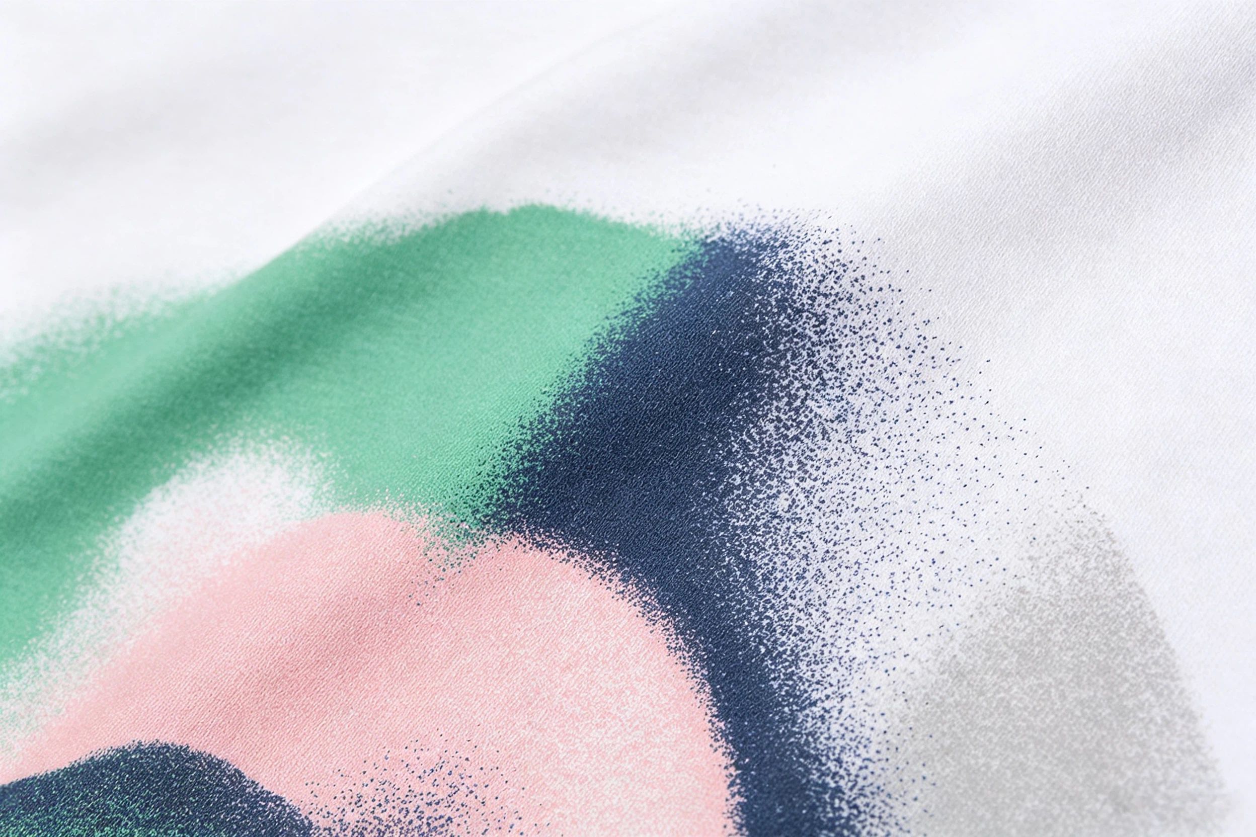 Close up of DTG direct-to-garment printing on cotton fabric showing soft matte finish with no texture